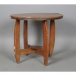 A Far Eastern hardwood occasional table, on shaped legs, height 52cm, diameter 58cm.Buyer’s