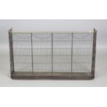 A mid-19th century wirework nursery fender with curved brass top rail, height 61cm, width 107cm,