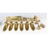 A collection of Victorian and later brass door furniture, including a ring shaped knocker,