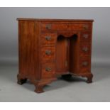 An early 20th century George III style mahogany kneehole desk, height 75cm, width 76cm, depth 46cm.
