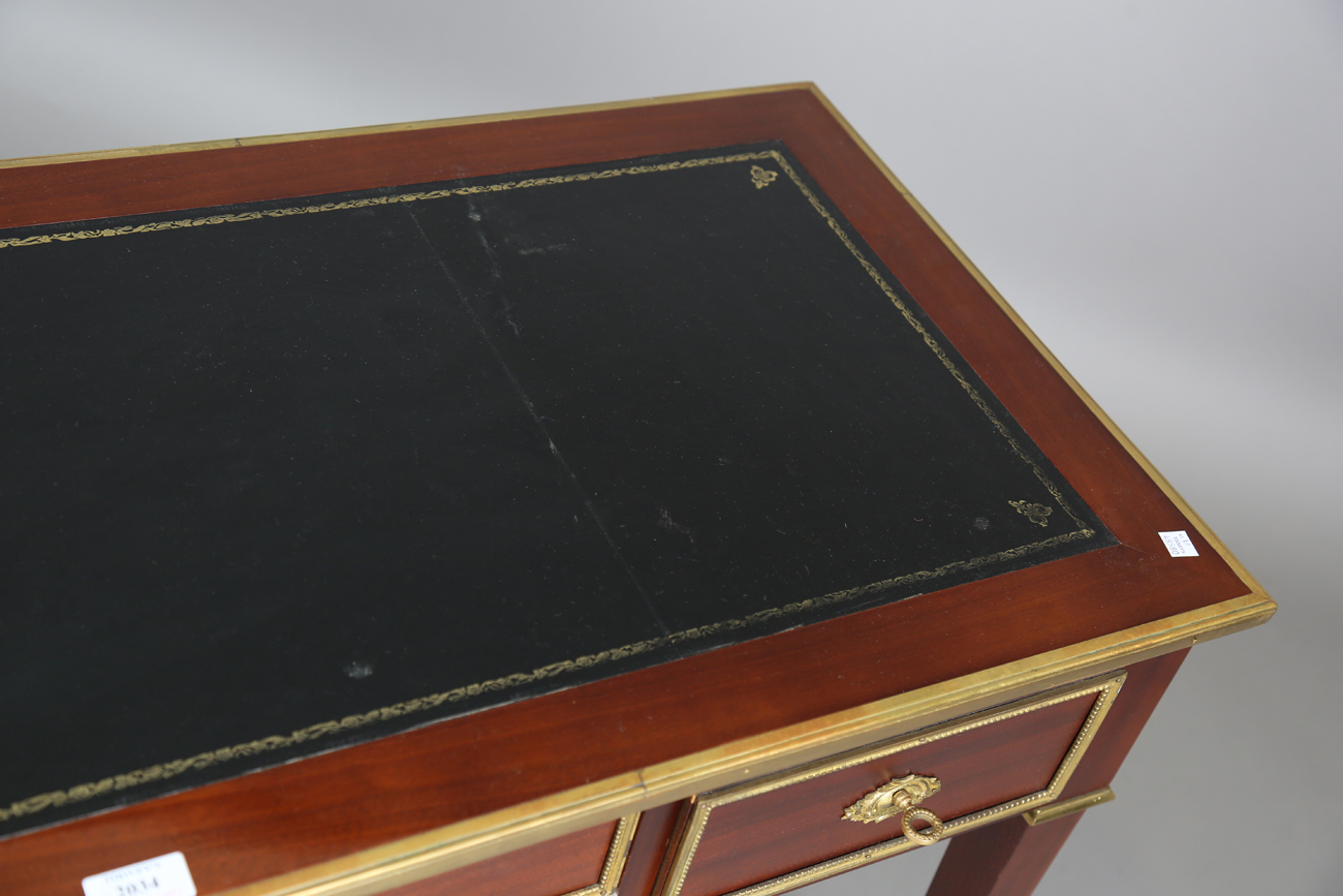 A 20th century French mahogany and gilt metal mounted writing table, fitted with three drawers, - Image 11 of 12