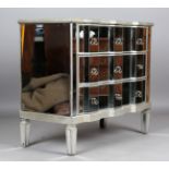 A modern mirrored and silvered chest of three drawers with shaped front, height 89cm, width 103cm,