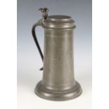 A Queen Anne pewter Beefeater flagon, inscribed 'C P T D Churchwardens 1702', the tappit lid with