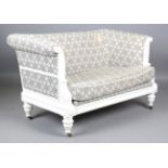 A modern Julian Chichester Regency style white painted showframe two-seat settee, the frame carved