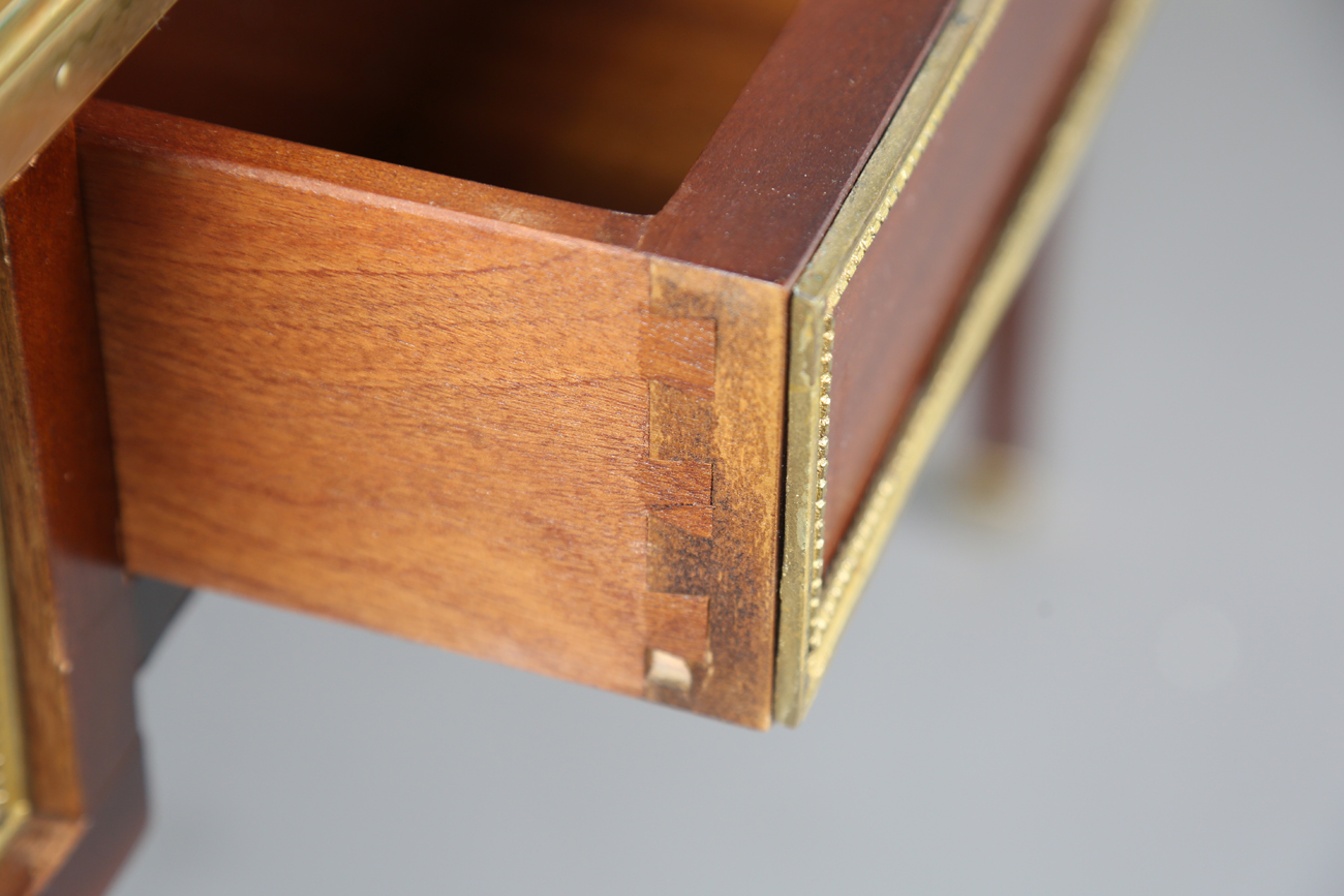 A 20th century French mahogany and gilt metal mounted writing table, fitted with three drawers, - Image 9 of 12