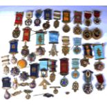 A selection of approximately thirty-seven mostly silver and enamelled Masonic badges and medals,