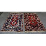 A Turkish rug, late 20th century, the red field with three cruciform medallions, within a blue