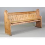 A 19th century pine pew with arched ends, height 89cm, width 186cm, depth 38cm.Buyer’s Premium 29.4%