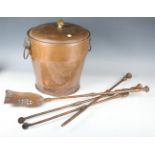 A set of three Victorian copper fire tools with pierced shovel and octagonal pommels, length 74cm,