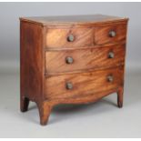 A small Regency mahogany bowfront chest of oak-lined drawers, height 85cm, width 90cm, depth 46cm.