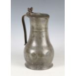 An 18th century Channel Islands pewter flagon, the tappit lid with twin-acorn thumbpiece above a