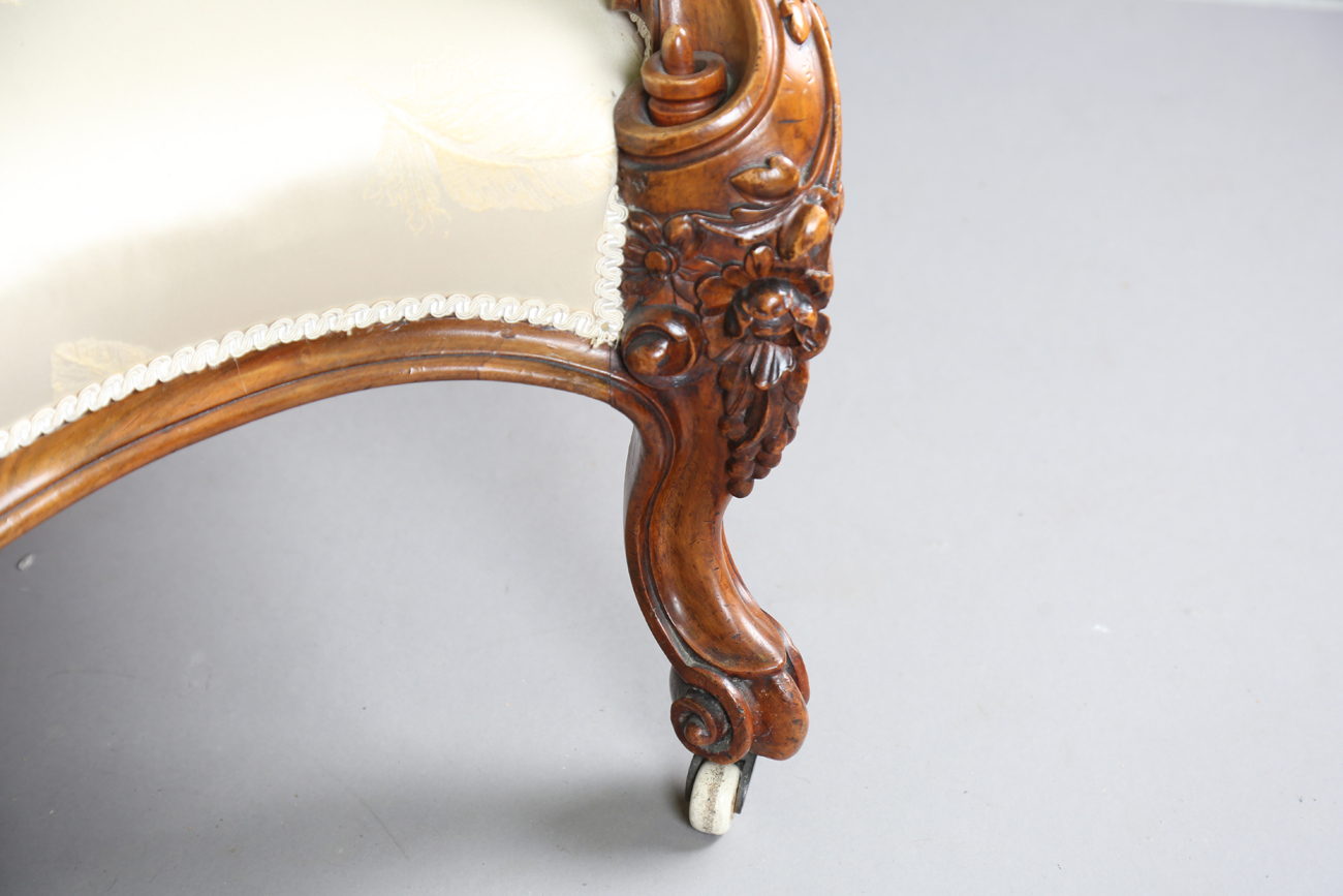 A fine mid-Victorian walnut showframe salon settee, the frame carved with flowers, leaves and fruit, - Image 3 of 11