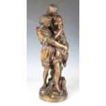 A modern brown patinated bronze figure group depicting a young man and his female companion, on a