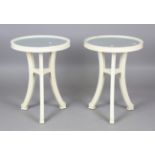 A pair of modern cream painted mirror-topped circular occasional tables, height 66cm, diameter