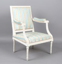A Louis XVI white painted showframe fauteuil armchair, upholstered in floral patterned striped silk,