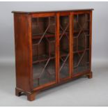 An early 20th century mahogany glazed bookcase, height 118cm, width 142cm, depth 34cm.Buyer’s