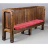 A large mid-20th century elm panelled back settle with chamfered corners, height 112cm, width 240cm,