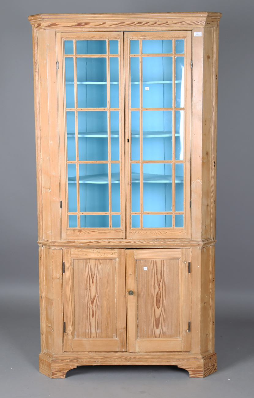 A George III pine floor-standing corner cupboard, the interior painted in sky blue, height 199cm,