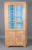A George III pine floor-standing corner cupboard, the interior painted in sky blue, height 199cm,