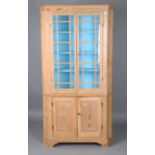 A George III pine floor-standing corner cupboard, the interior painted in sky blue, height 199cm,