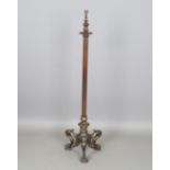 A 20th century coppered brass lampstandard of Neoclassical design, raised on claw feet,