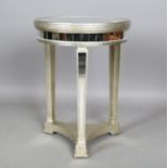 A modern mirrored and silvered circular occasional table, height 69cm, diameter 51cm.Buyer’s Premium