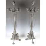 A pair of mid-19th century Neoclassical Revival patinated cast bronze seven-branch candelabra,