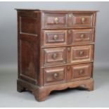 A 17th century and later oak chest of four drawers with applied geometric mouldings, height 113cm,