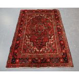 A Heriz rug, North-west Persia, mid/late 20th century, the red field with a flowerhead medallion,