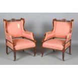 A pair of Edwardian walnut showframe armchairs, upholstered in patterned pink damask, height 93cm,