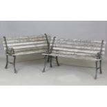 A pair of 20th century cast iron and wooden slatted garden benches, height 70cm, width 122cm.Buyer’s