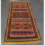 An unusual Moroccan rug, late 20th century, the polychrome field with sections of flatweave, 226cm x