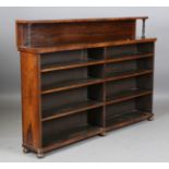 A Regency rosewood open bookcase, the shelf back with acanthus carved supports, height 117cm,