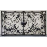 A late 19th century wrought iron rectangular balcony panel, finely worked with applied leaves and