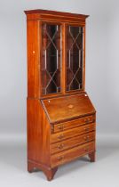 An Edwardian mahogany bureau bookcase, the fall flap inlaid with a conch shell, height 207cm,