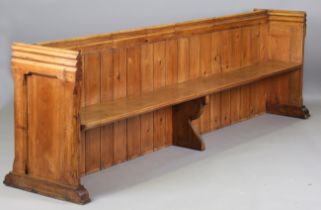 A late 19th/early 20th century pine pew, height 85cm, width 276cm, depth 47cm.Buyer’s Premium 29.