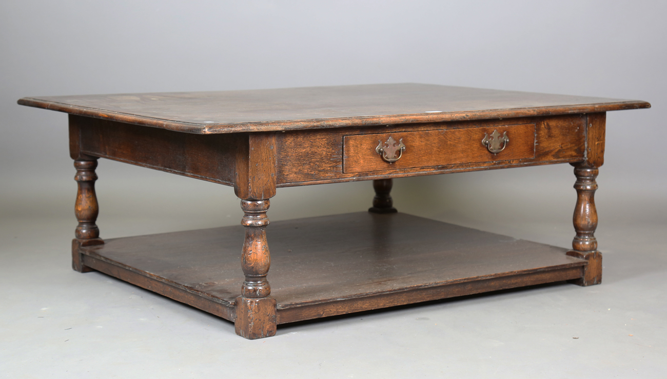 A modern Jacobean style solid oak coffee table, fitted with a single drawer, height 50cm, width