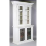 A late 19th century grey painted bookcase cabinet with carved foliate mouldings and frosted glass