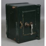 A late 19th/early 20th century green painted cast iron safe, the interior fitted with a drawer,