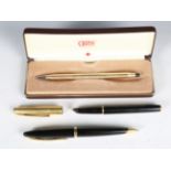 A Waterman black cased fountain pen with gold plated cap, a similar Waterman ballpoint pen and a