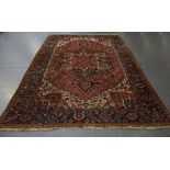 A Heriz carpet, North-west Persia, mid-20th century, the terracotta field with a bold medallion,