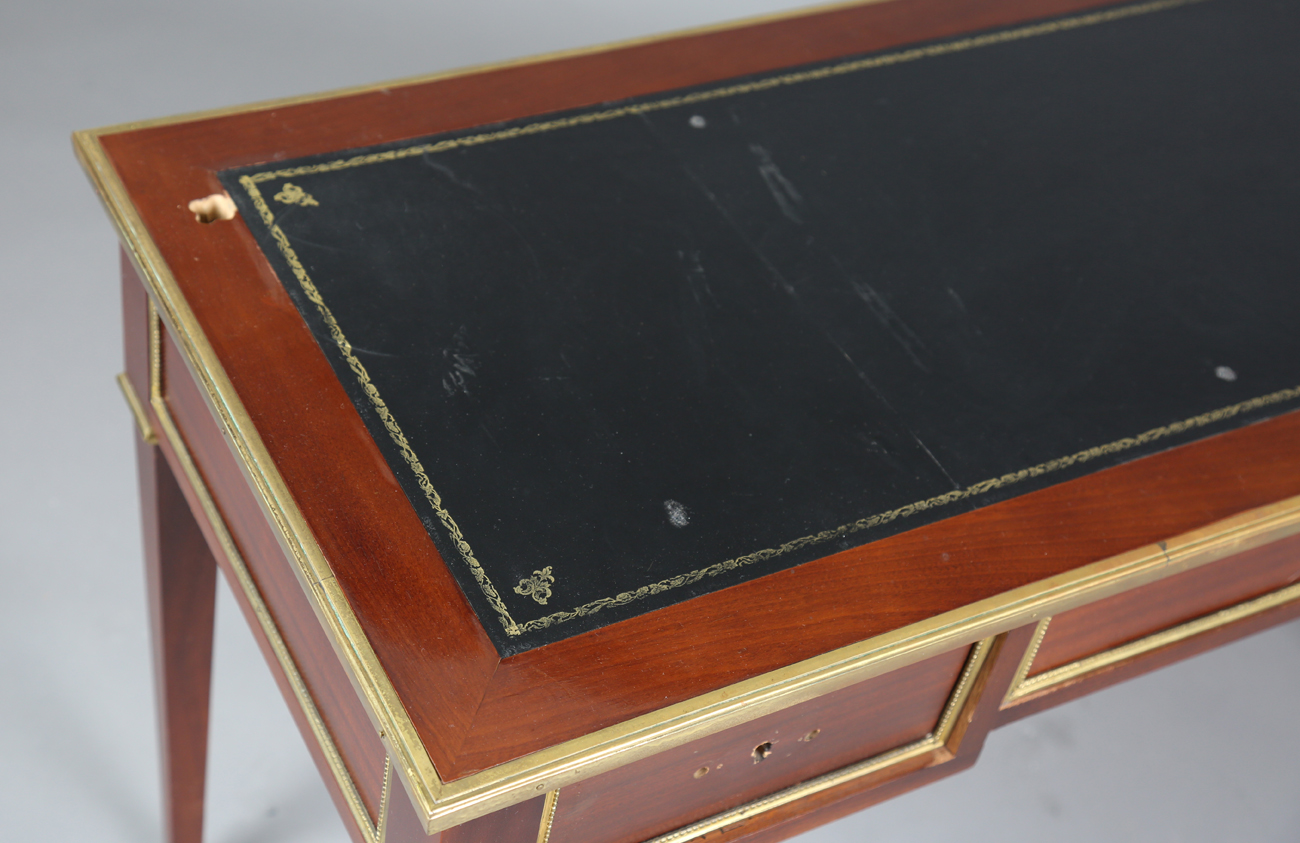 A 20th century French mahogany and gilt metal mounted writing table, fitted with three drawers, - Image 12 of 12