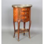 A 20th century French Transitional style kingwood, rosewood and marquetry inlaid oval chest of three