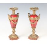 A pair of late 19th century porcelain and gilt metal mounted cassolettes, each of twin-handled urn