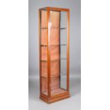 A late Victorian mahogany framed shop display cabinet, fitted with a single glazed door, height