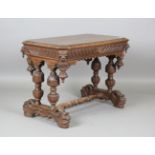 A late Victorian Gothic Revival oak centre table, the canted rectangular top above a single
