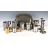 A group of 18th and 19th century pewter, including a platter, length 36cm, an 18th century tankard