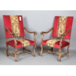 A pair of late 19th/early 20th century French walnut framed open armchairs with carved acanthus leaf