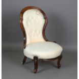 A small Victorian walnut showframe nursing chair, upholstered in cream patterned fabric, height