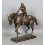 A large modern cast bronze equestrian figure depicting a jockey on his mount, incised to the base '